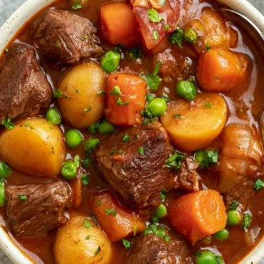 Slow cooker beef stew recipe with tender meat and colorful vegetables