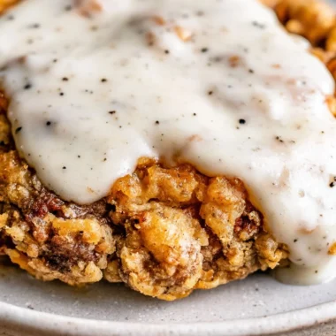 Delicious chicken fried steak served with gravy and sides