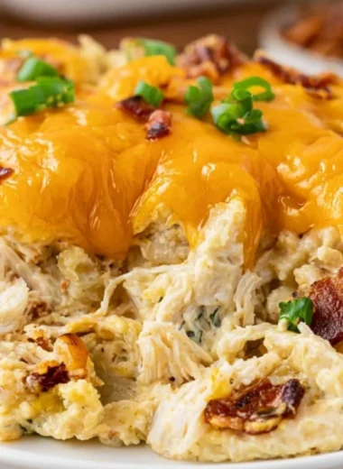 Cozy Crack Chicken Casserole dish with chicken, cheese, and bacon toppings