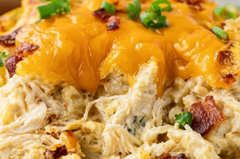 Cozy Crack Chicken Casserole dish with chicken, cheese, and bacon toppings