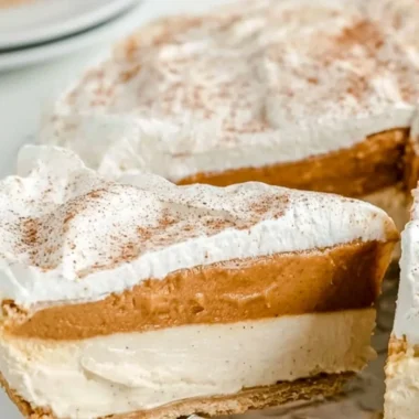 Delicious no-bake pumpkin pie garnished with whipped cream and spices