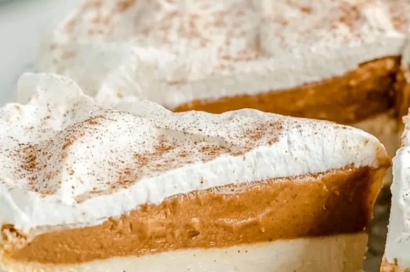 Delicious no-bake pumpkin pie garnished with whipped cream and spices