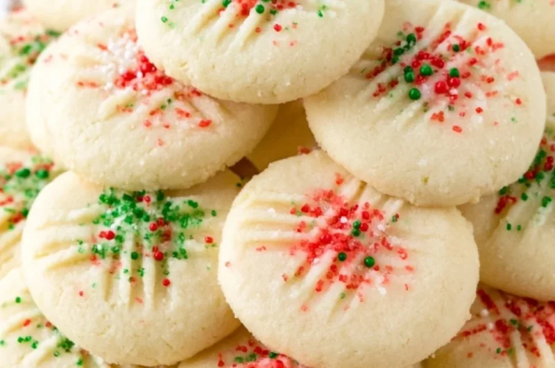 Delicious whipped shortbread cookies on a cozy plate, perfect for the holidays.