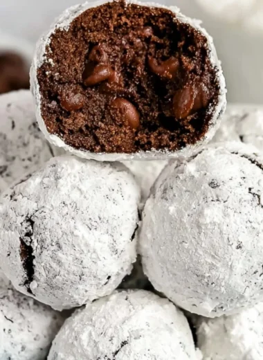 Double chocolate snowball cookies dusted with powdered sugar, ready to enjoy.
