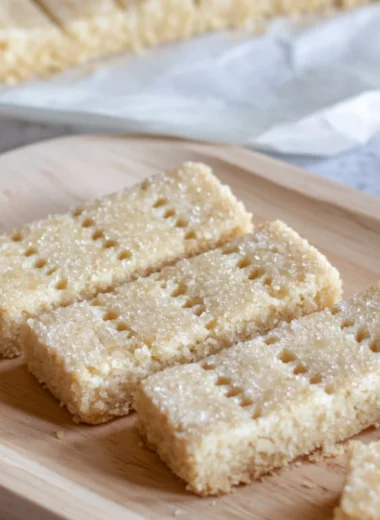 Baked Scottish shortbread cookies on a rustic wooden table
