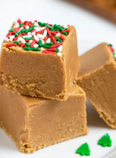 Delicious warm gingerbread fudge served on a festive plate with holiday decorations.