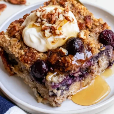 Delicious blueberry baked oatmeal served in a bowl with fresh blueberries on top