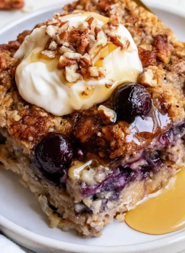 Delicious blueberry baked oatmeal served in a bowl with fresh blueberries on top