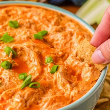 Delicious Buffalo Chicken Dip served with tortilla chips at a party