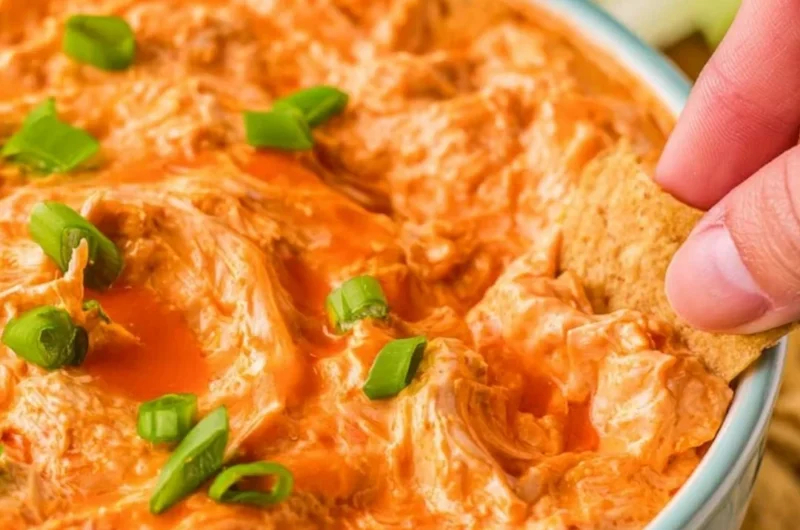 Delicious Buffalo Chicken Dip served with tortilla chips at a party