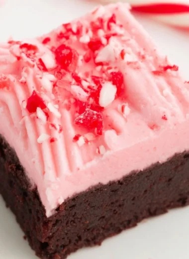 Decadent Candy Cane Brownies decorated with crushed candy canes for Christmas