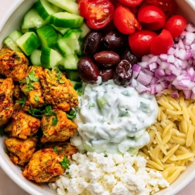 High-protein chicken gyro bowls with fresh vegetables and tzatziki sauce