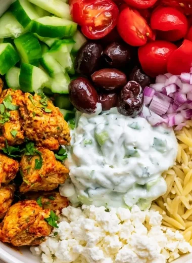 High-protein chicken gyro bowls with fresh vegetables and tzatziki sauce