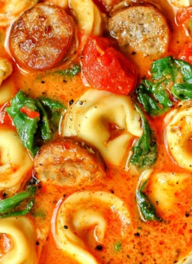 Bowl of healthy tortellini soup with vegetables for a comforting fall meal