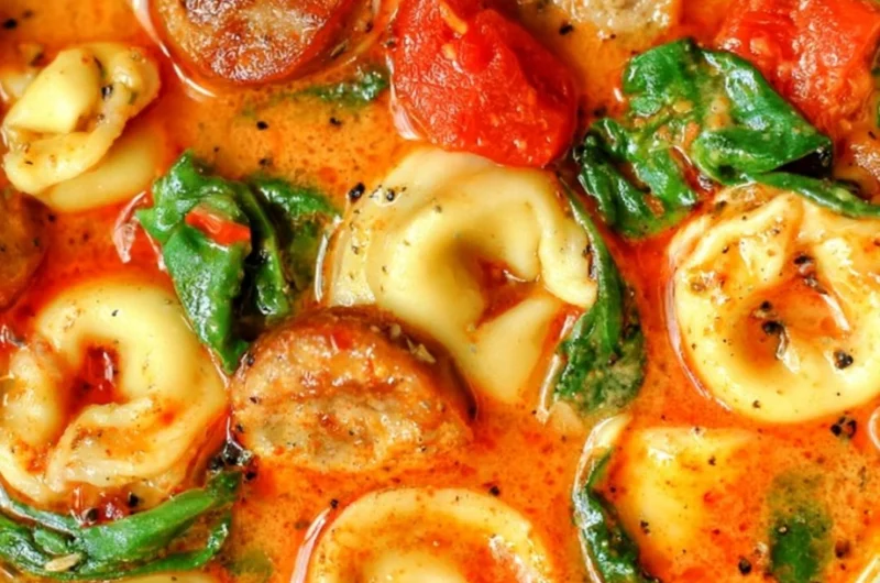 Bowl of healthy tortellini soup with vegetables for a comforting fall meal