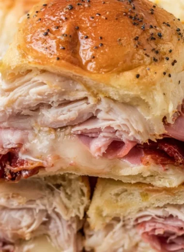 Buttery baked club sliders on a platter, ready to serve for any occasion