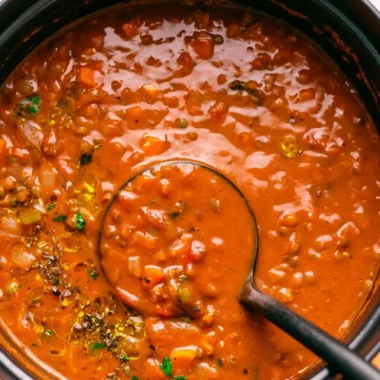 Bowl of Mediterranean Lentil Soup garnished with herbs and spices