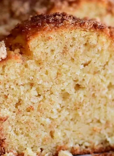 Deliciously spiced Eggnog Loaf topped with holiday decorations
