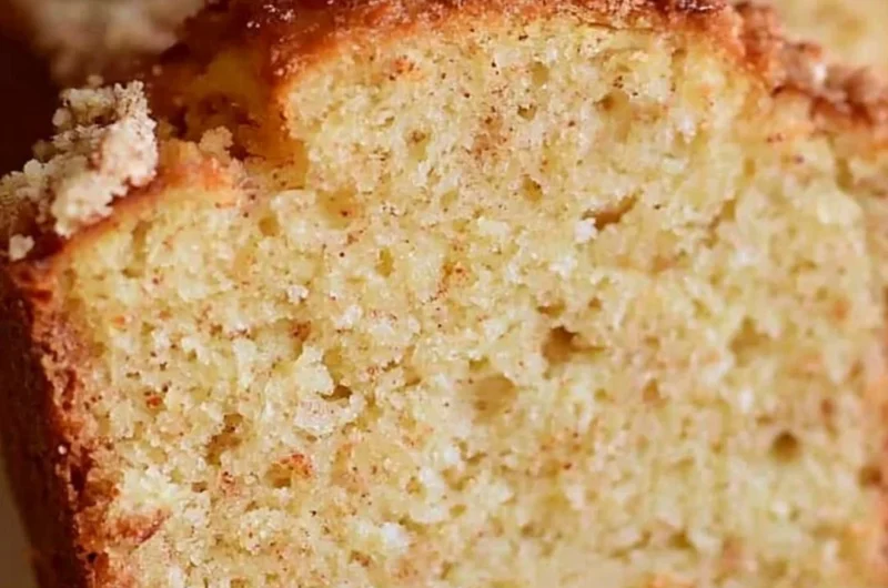 Deliciously spiced Eggnog Loaf topped with holiday decorations